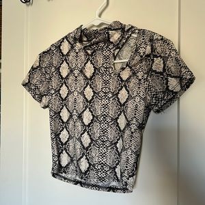 cropped snake skin mock turtle neck shirt with cut out on left collar bone